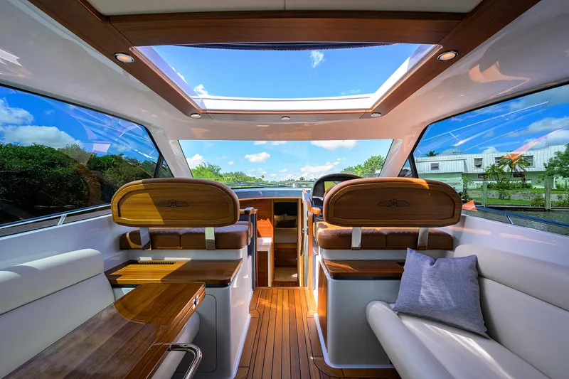 Slide: The Image of Luxurious interior of 2024 Palm Beach Motor Yachts GT50 with panoramic windows and elegant wood finishes. - 44
