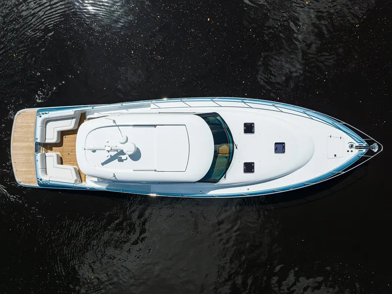 Slide: The Image of 2024 Palm Beach Motor Yachts GT50, aerial view, sleek design, luxury yacht on water. - 10