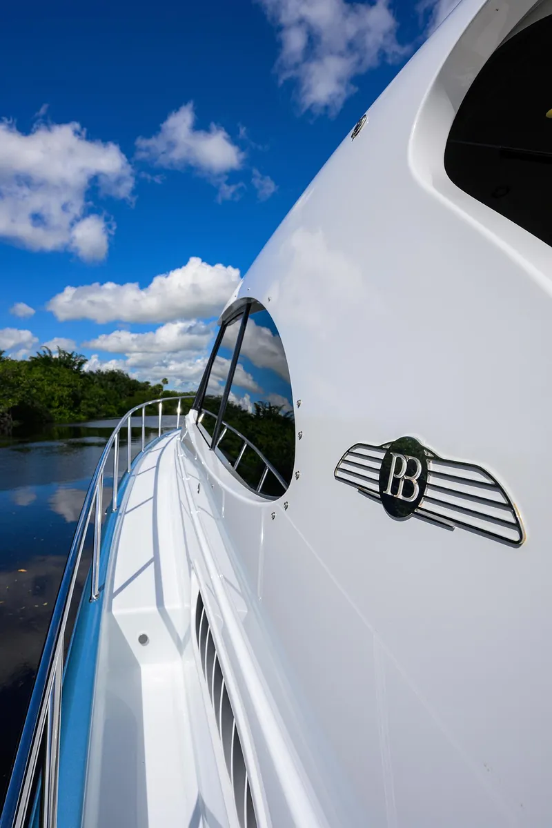 Slide: The Image of 2024 Palm Beach Motor Yachts GT50 cruising on a sunny day with blue skies. - 26
