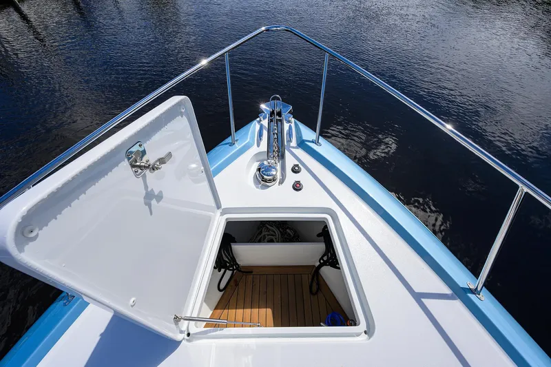Slide: The Image of 2024 Palm Beach Motor Yachts GT50 bow with open hatch, showcasing sleek design and craftsmanship. - 33