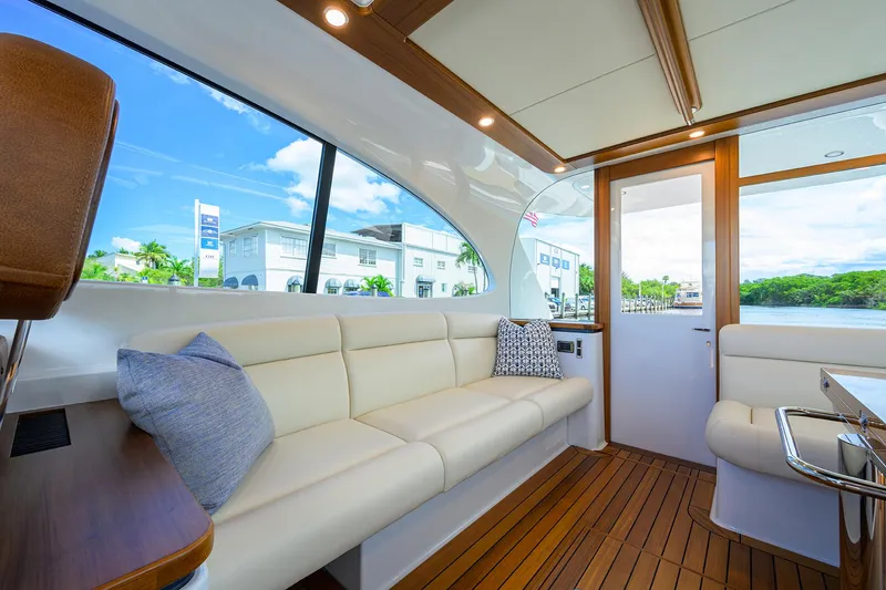 Slide: The Image of Luxurious interior of 2024 Palm Beach Motor Yachts GT50 with elegant seating and wood accents. - 36