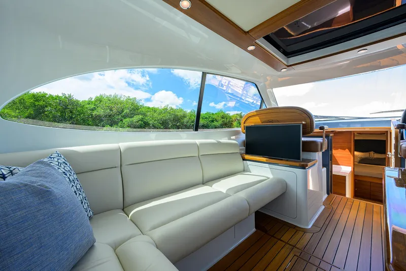 Slide: The Image of Luxurious interior of 2024 Palm Beach Motor Yachts GT50 with plush seating and scenic window view. - 37