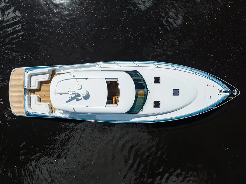 Slide: The Image of 2024 Palm Beach Motor Yachts GT50, aerial view, sleek design, luxury yacht on water. - 9