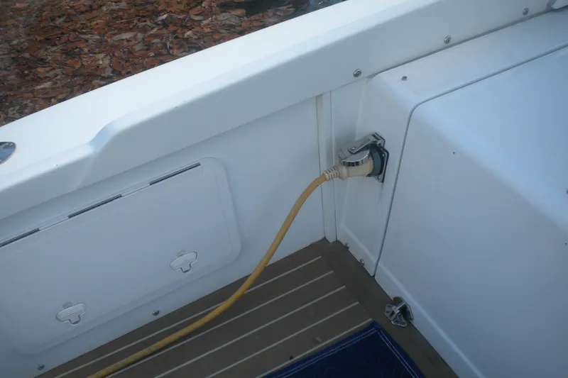 Slide: The Image of 1979 Bertram Flybridge Cruiser with shore power connection on deck. - 14
