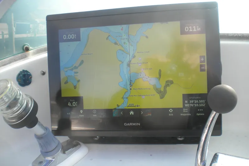 Slide: The Image of Garmin navigation display on 1979 Bertram Flybridge Cruiser, showing nautical map and coordinates. - 5