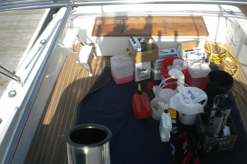 Slide: The Image of 1979 Bertram Flybridge Cruiser deck with maintenance supplies and equipment. - 16