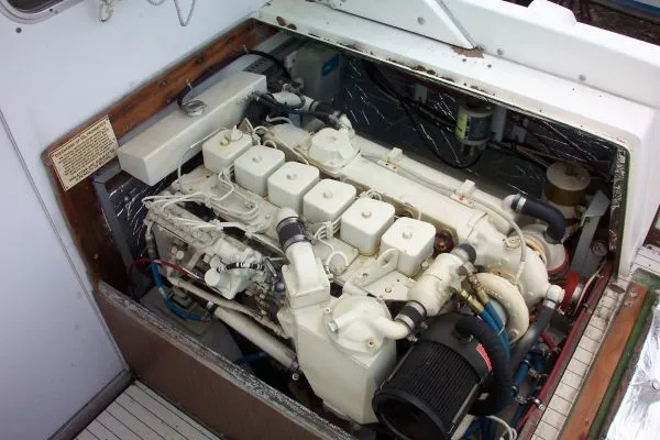 Slide: The Image of Engine compartment of a 1979 Bertram Flybridge Cruiser, showcasing detailed mechanical components. - 21
