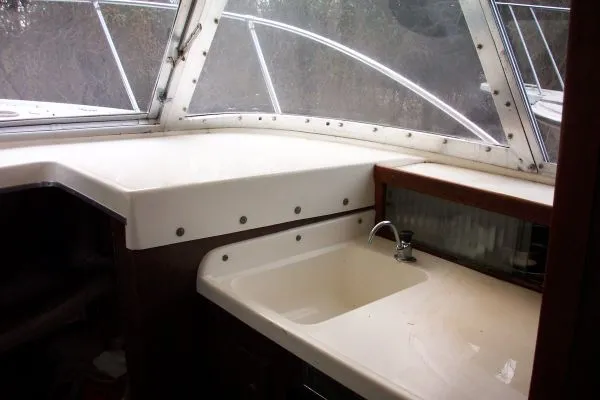 Slide: The Image of 1979 Bertram Flybridge Cruiser interior with sink and counter space. - 9