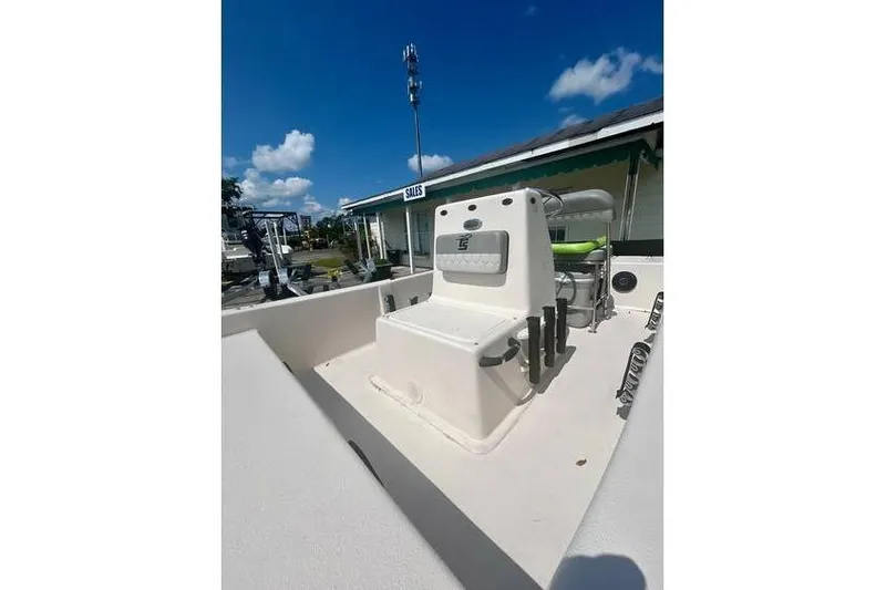 Slide: The Image of 2026 Carolina Skiff 16 JVX CC boat console under clear blue sky. - 4