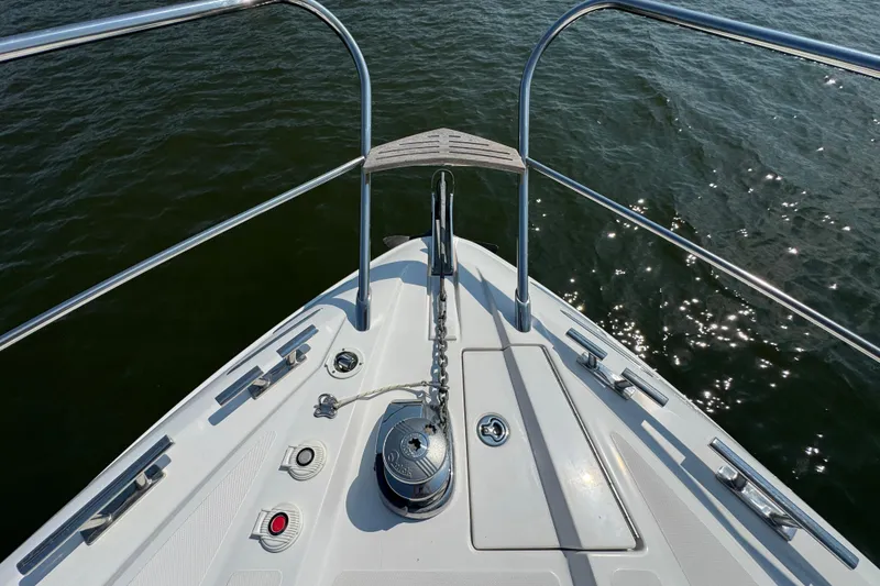 Slide: The Image of Bow of 2013 Sessa Marine C44 Cruiser with anchor chain over water. - 10