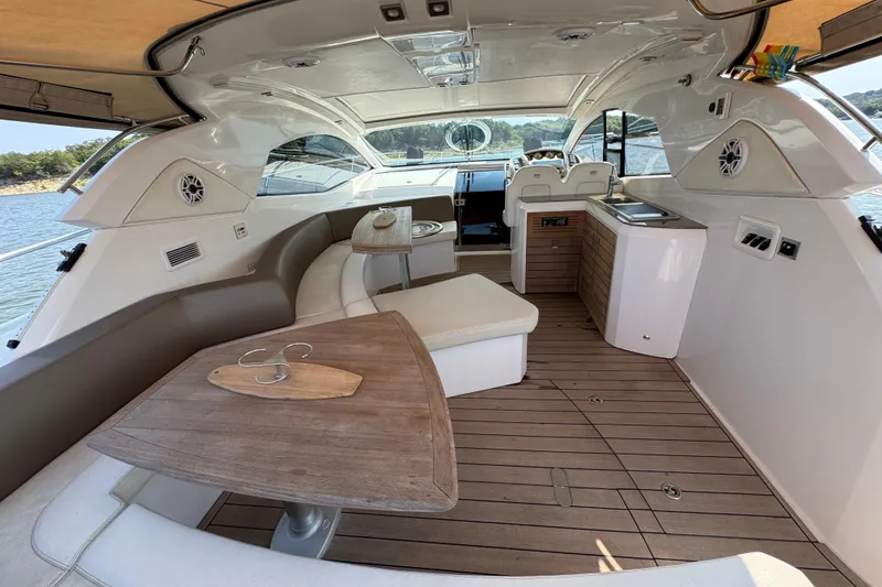 Slide: The Image of Luxurious interior of 2013 Sessa Marine C44 Cruiser with elegant seating and wooden accents. - 13