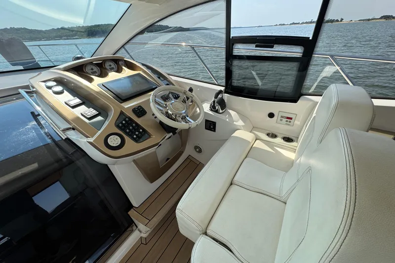 Slide: The Image of Cockpit of 2013 Sessa Marine C44 Cruiser with modern controls and leather seating. - 15