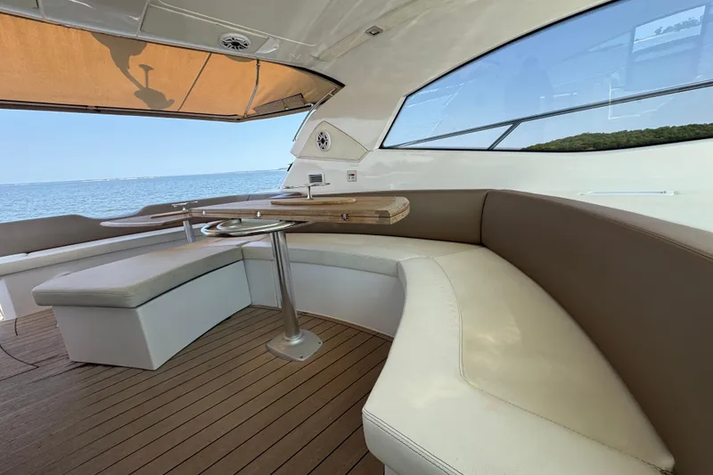 Slide: The Image of 2013 Sessa Marine C44 Cruiser interior with elegant seating and ocean view. - 16
