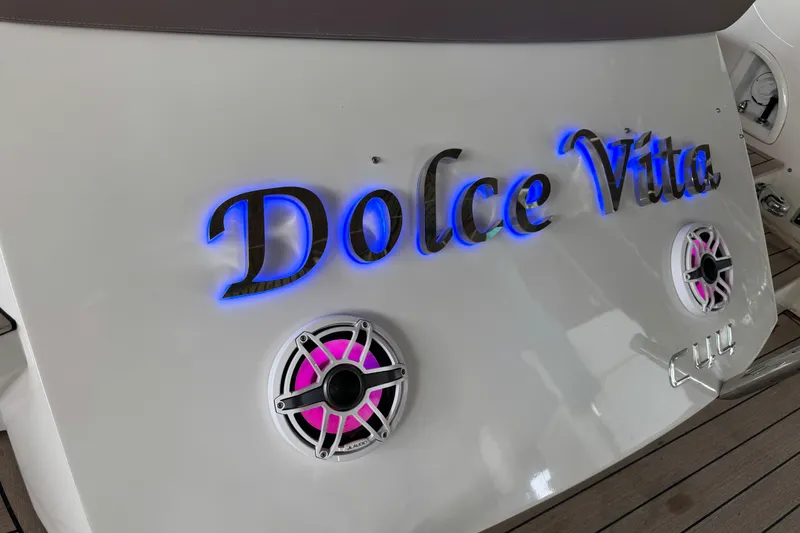 Slide: The Image of Sessa Marine C44 Cruiser 2013 with "Dolce Vita" name and illuminated speakers. - 23