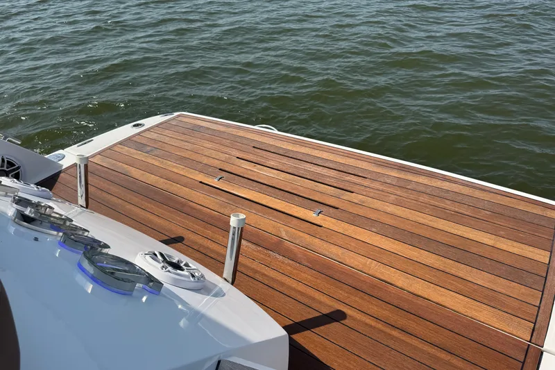 Slide: The Image of Sessa Marine C44 Cruiser 2013, teak deck, overlooking calm water. - 25