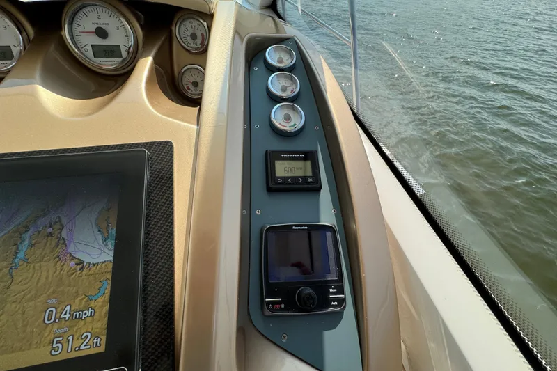 Slide: The Image of Dashboard of 2013 Sessa Marine C44 Cruiser with navigation and engine gauges. - 29
