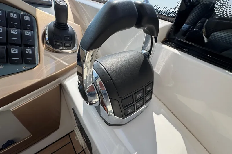 Slide: The Image of Control panel of a 2013 Sessa Marine C44 Cruiser with joystick and throttle. - 30