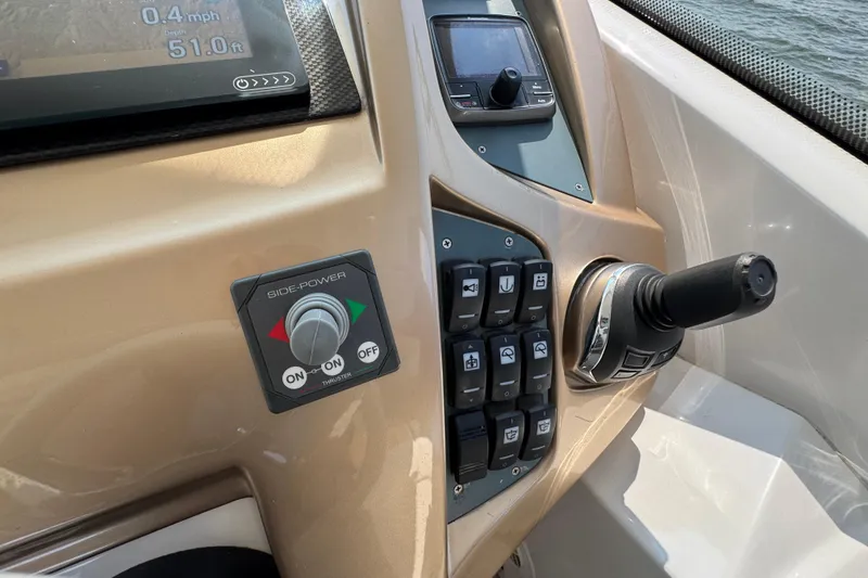 Slide: The Image of Control panel of 2013 Sessa Marine C44 Cruiser with joystick and side-power thruster. - 31