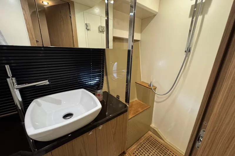 Slide: The Image of Modern bathroom in 2013 Sessa Marine C44 Cruiser with sink and shower. - 37
