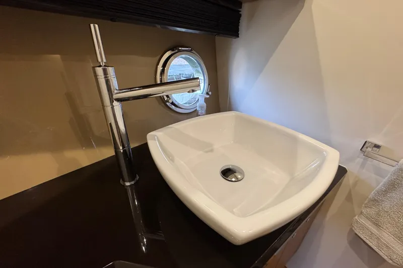 Slide: The Image of Modern bathroom sink and faucet on Sessa Marine C44 Cruiser, 2013 model. - 46