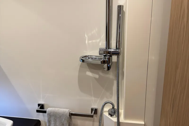 Slide: The Image of Shower area in 2013 Sessa Marine C44 Cruiser with chrome fixtures and towel rack. - 47