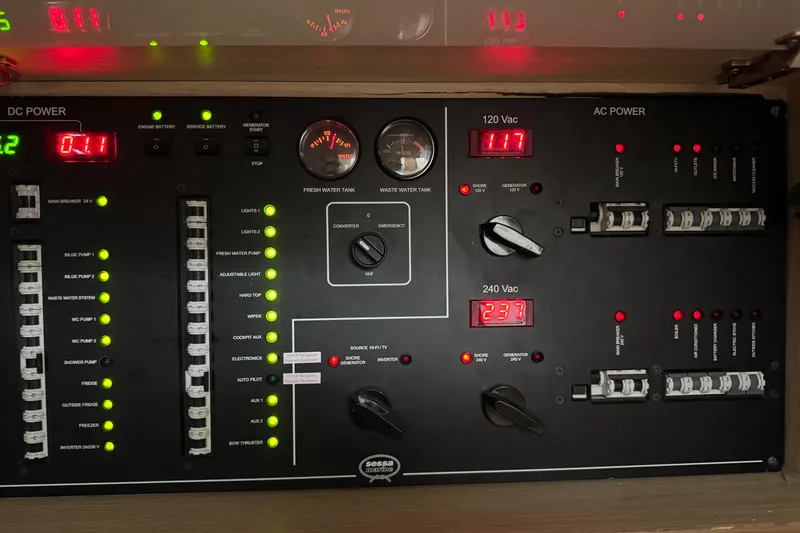 Slide: The Image of Control panel of a 2013 Sessa Marine C44 Cruiser, displaying DC and AC power systems. - 48