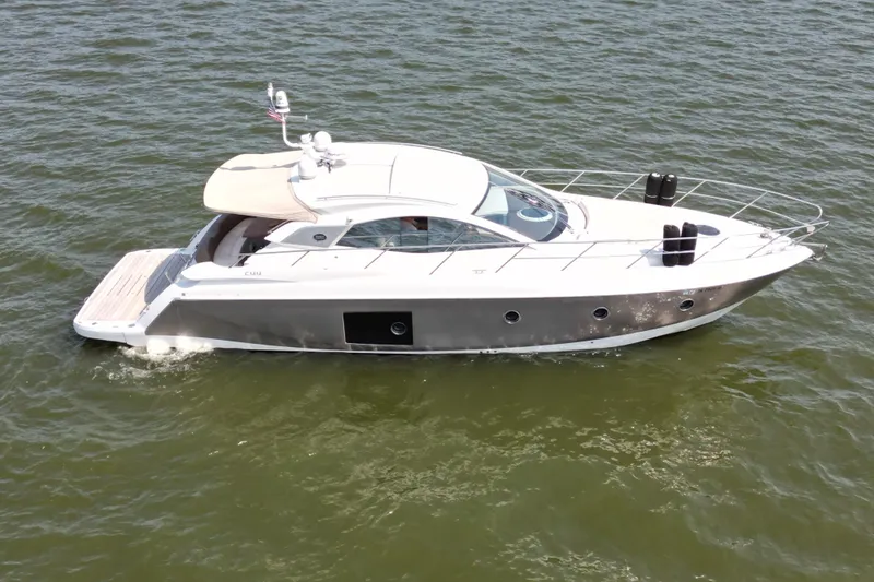 Slide: The Image of 2013 Sessa Marine C44 Cruiser yacht on open water, side view. - 5