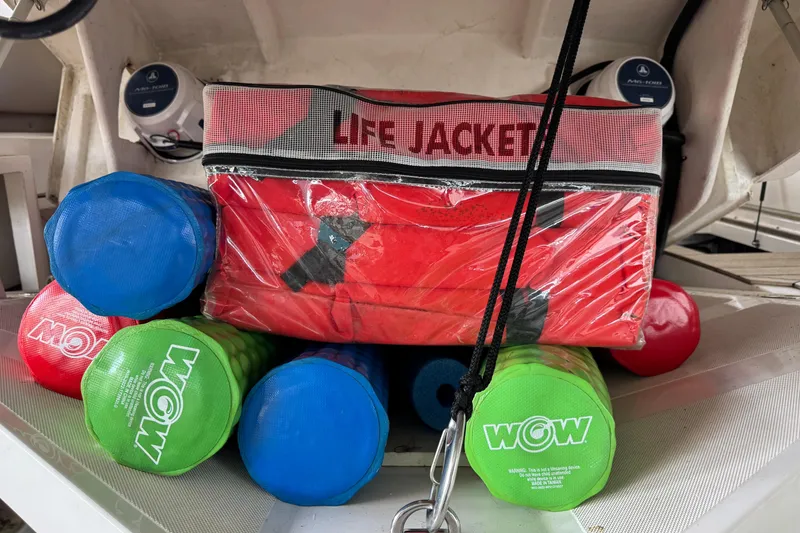 Slide: The Image of Life jackets and colorful floats stored on a 2013 Sessa Marine C44 Cruiser. - 55