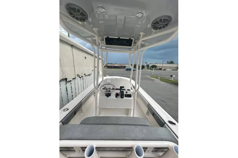 Slide: The Image of 2026 Carolina Skiff 24 Ultra Elite boat interior with steering console and seating. - 6