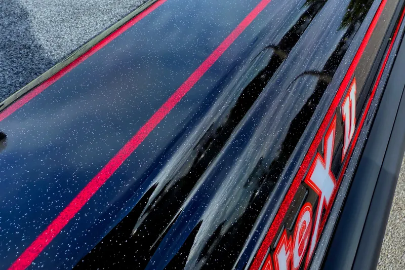 Slide: The Image of 2026 Phoenix 921 Elite X II boat interior with gray seating and spacious deck. - 10