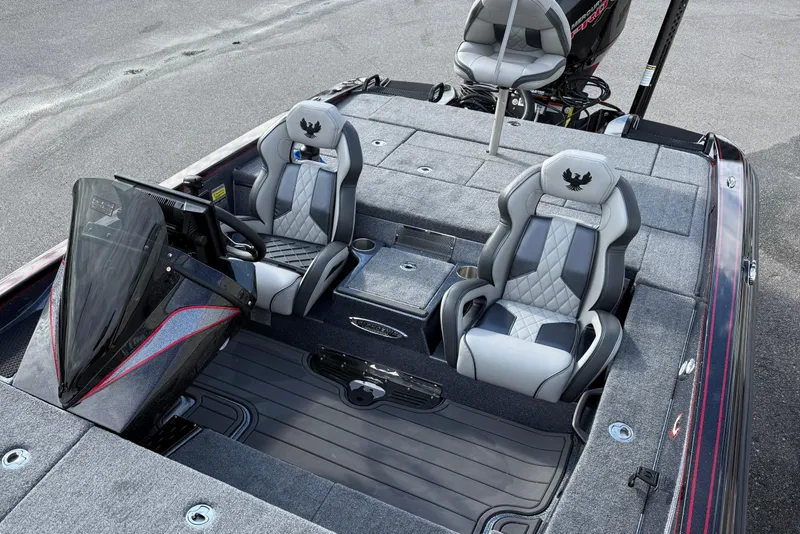 Slide: The Image of Interior of 2026 Phoenix 921 Elite X II boat, featuring steering wheel and control panel. - 16