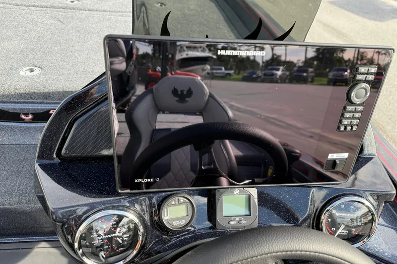 Slide: The Image of Interior of 2026 Phoenix 921 Elite X II boat with sleek seating and modern controls. - 19