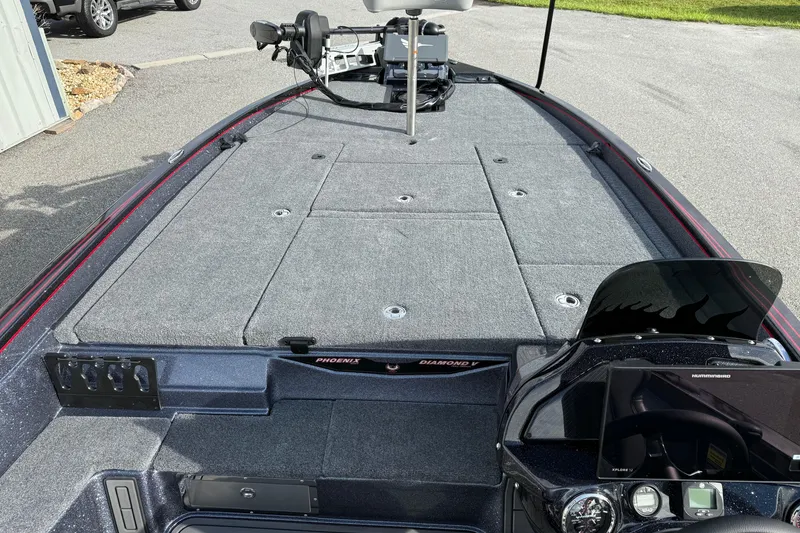 Slide: The Image of 2026 Phoenix 921 Elite X II boat interior with gray seating and advanced dashboard. - 22