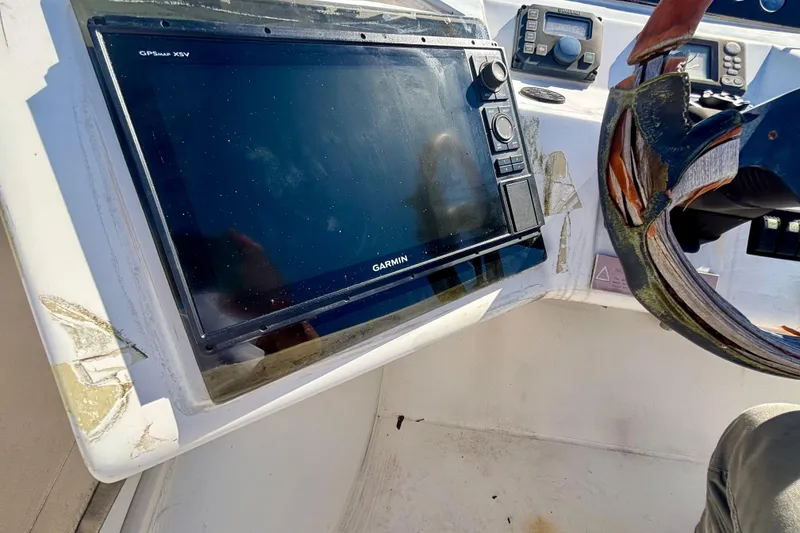 Slide: The Image of Garmin GPS system on 2004 Viking Princess 61 Fly Bridge yacht dashboard. - 14