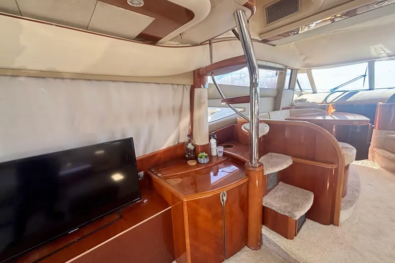 Slide: The Image of Luxurious interior of 2004 Viking Princess 61 Fly Bridge yacht with elegant wood finishes. - 25