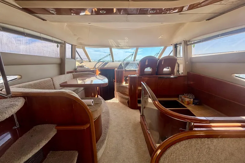 Slide: The Image of Luxurious interior of 2004 Viking Princess 61 Fly Bridge yacht with elegant wood finishes. - 26