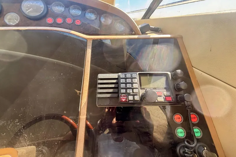 Slide: The Image of Control panel of 2004 Viking Princess 61 Fly Bridge yacht with radio and gauges. - 39