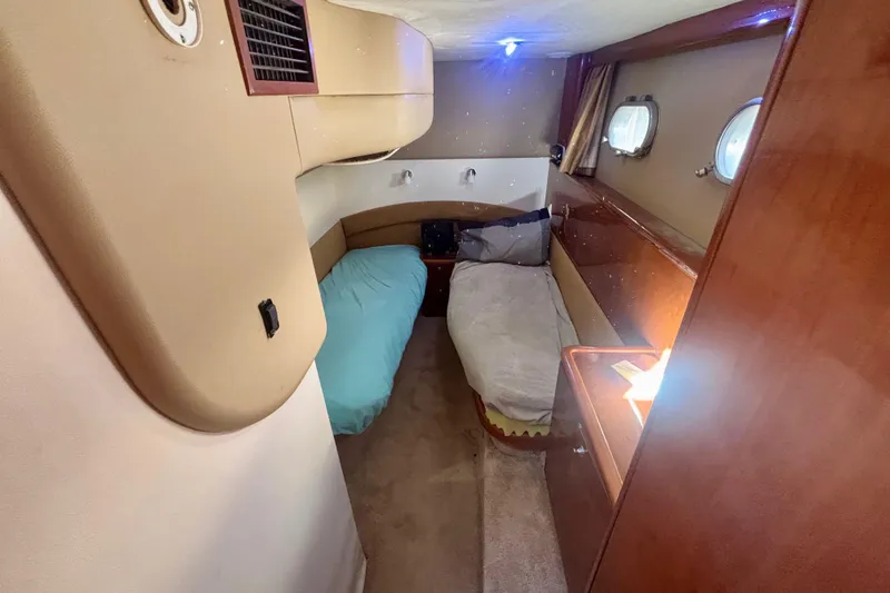 Slide: The Image of Cozy cabin interior of 2004 Viking Princess 61 Fly Bridge yacht with twin beds. - 53