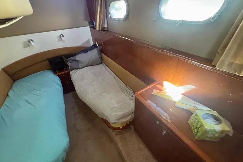 Slide: The Image of Interior cabin of 2004 Viking Princess 61 Fly Bridge yacht with twin beds. - 55