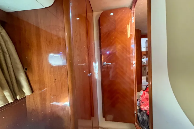 Slide: The Image of Interior of 2004 Viking Princess 61 Fly Bridge yacht with wooden doors and elegant design. - 56