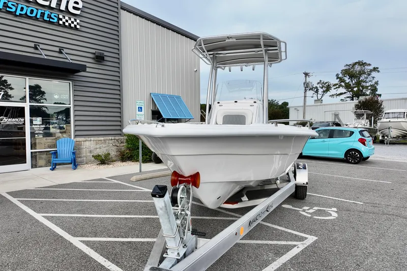 Slide: The Image of 2026 ALK2 22CRX boat on trailer outside dealership, parked in handicap spot. - 2