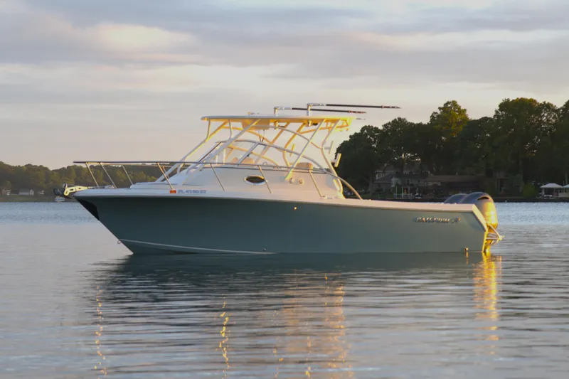 The Image of 2020 Sailfish 270 WAC boat on calm water at sunset. - 1