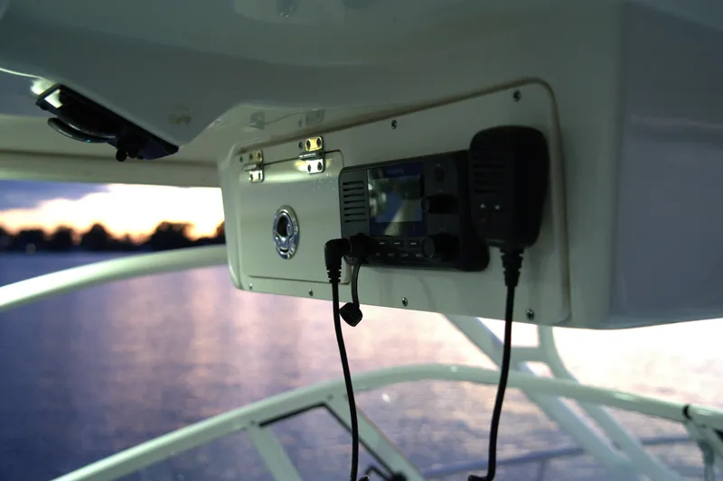 Slide: The Image of 2020 Sailfish 270 WAC boat interior with radio equipment at sunset. - 15