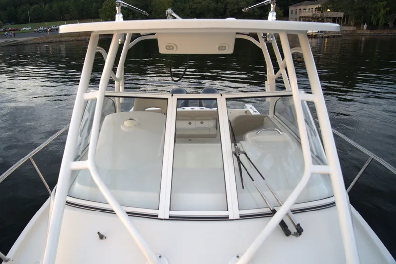 Slide: The Image of 2020 Sailfish 270 WAC boat on calm water, featuring a sleek design and sturdy frame. - 16