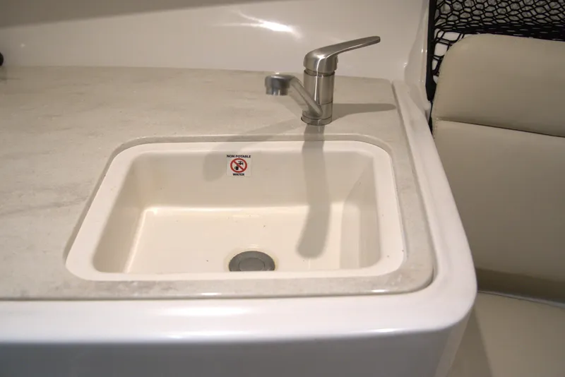 Slide: The Image of Sink with faucet in 2020 Sailfish 270 WAC boat, labeled non-potable water. - 29