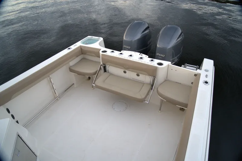 Slide: The Image of 2020 Sailfish 270 WAC boat with dual engines and spacious seating area. - 6