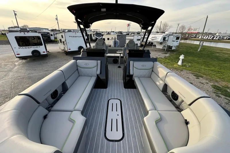 Slide: The Image of 2024 Veranda VX 25 DCVL pontoon boat with spacious seating and modern design. - 11