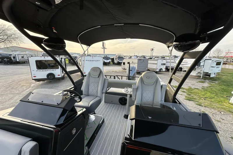 Slide: The Image of 2024 Veranda VX 25 DCVL pontoon boat interior with modern seating and dashboard. - 13