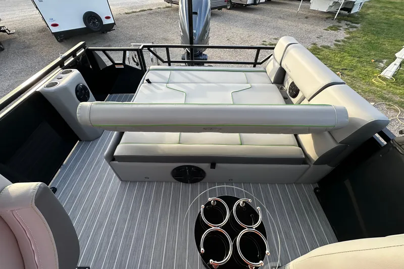 Slide: The Image of 2024 Veranda VX 25 DCVL pontoon boat interior with luxurious seating and cup holders. - 15