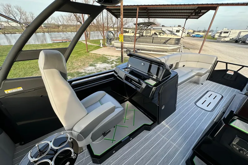Slide: The Image of 2024 Veranda VX 25 DCVL pontoon boat interior with helm, seating, and modern design. - 17
